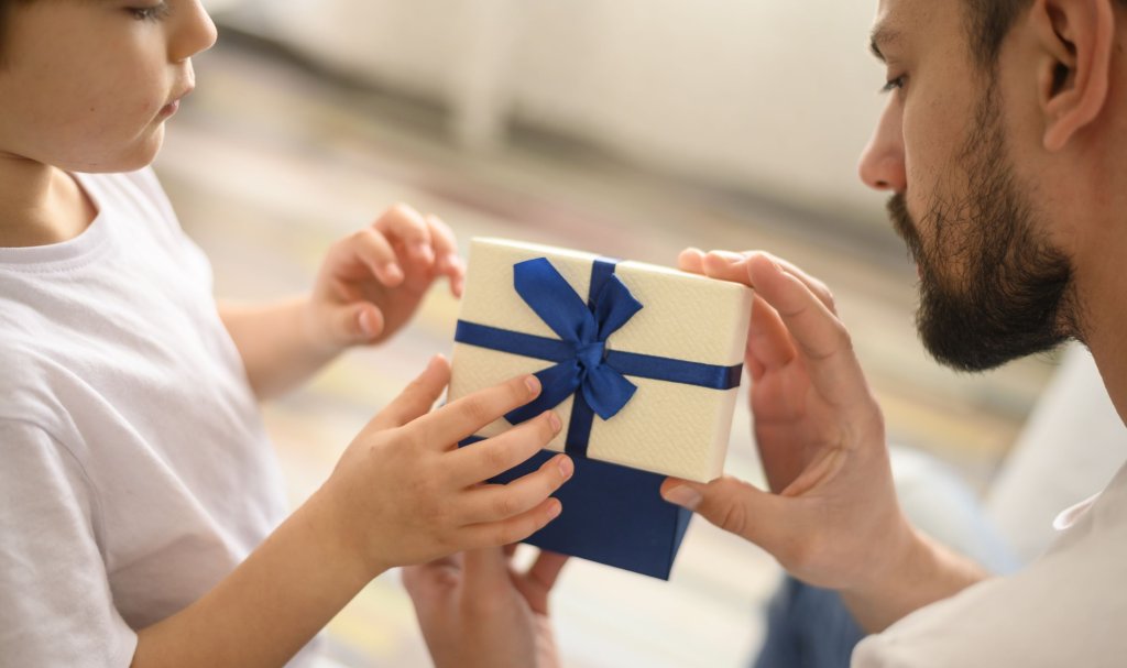 close-up-kid-offering-present.jpg