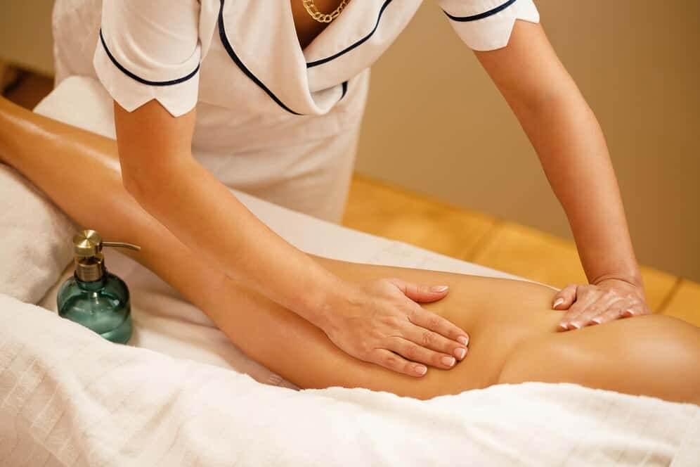 unrecognizable-therapist-massaging-thighs-woman-spa_637285-2120.jpg