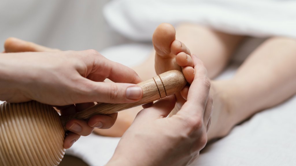 close-up-therapist-using-wooden-tool.jpg